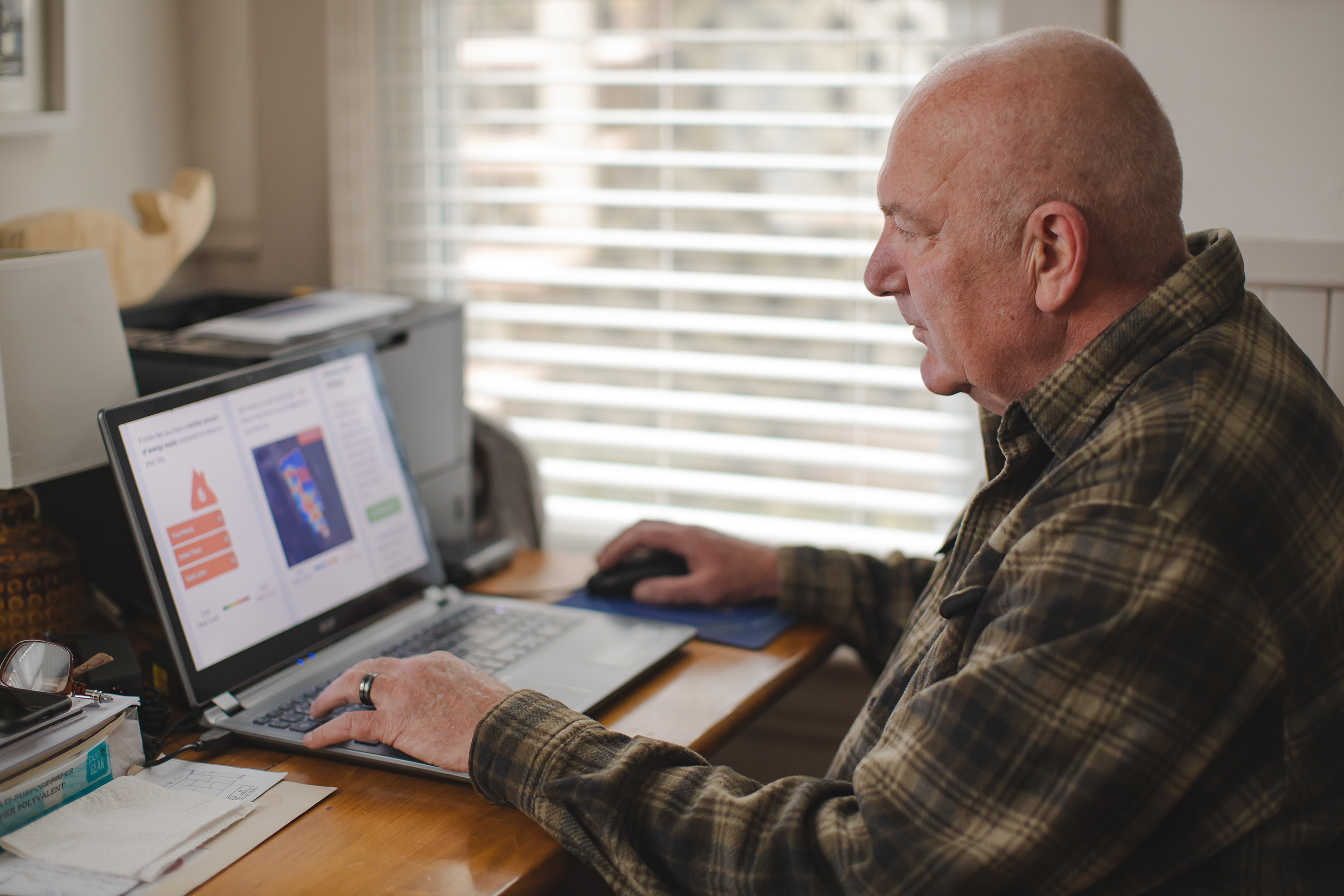 Gary Grattan, a homeowner in Saint John, New Brunswick, uses MyHEAT's online heat loss maps to identify areas of higher heat loss in his home. 
