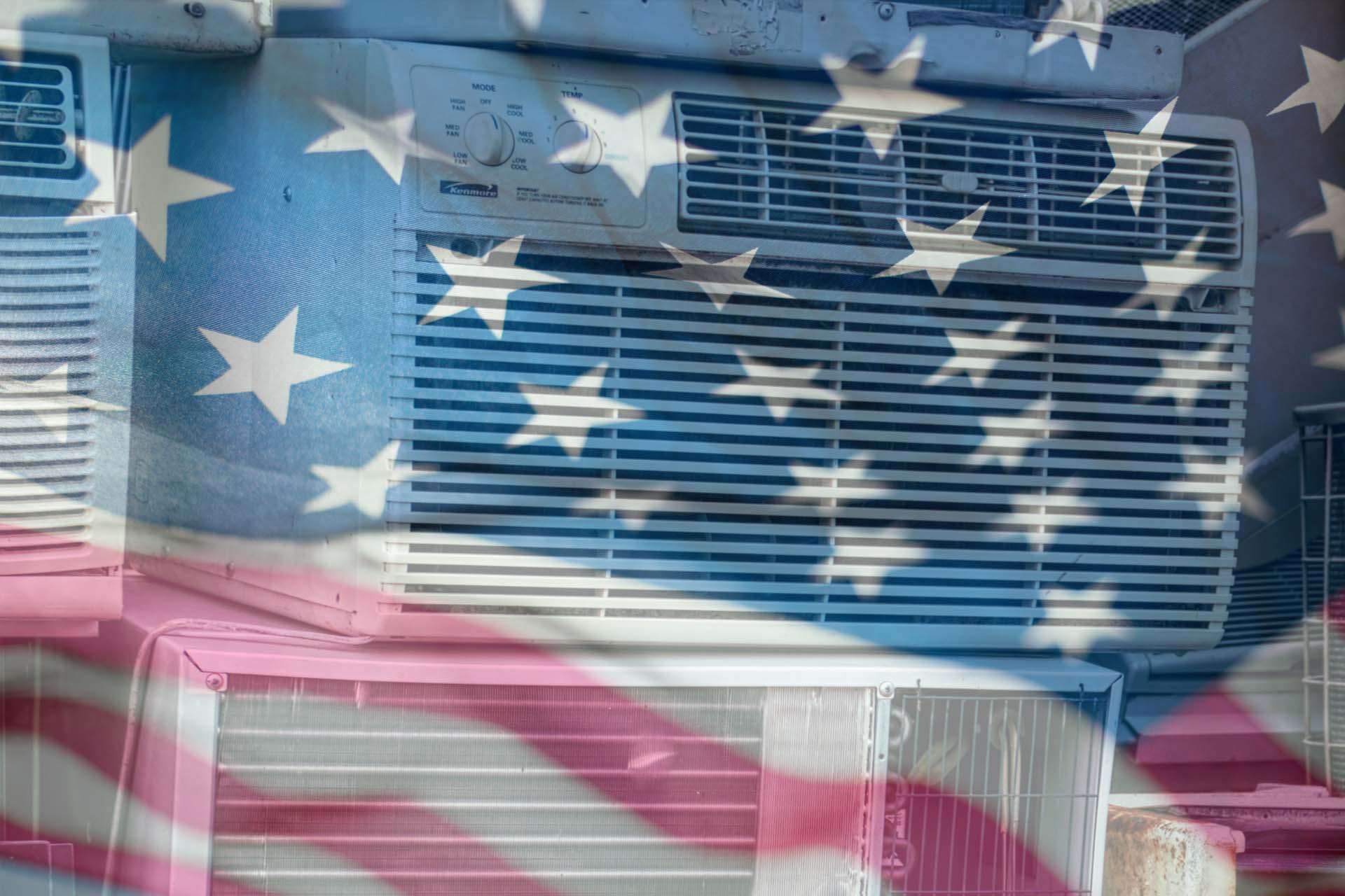 A U.S flag superimposed over old air conditioner units