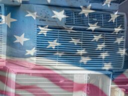 A U.S flag superimposed over old air conditioner units